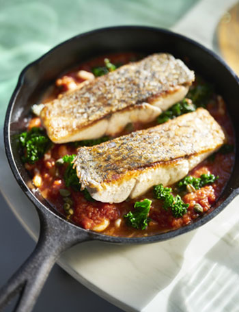 Pan fried barramundi with calamari, tomato and capers