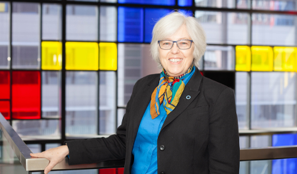 Alicia Jenkins in front of colourful window