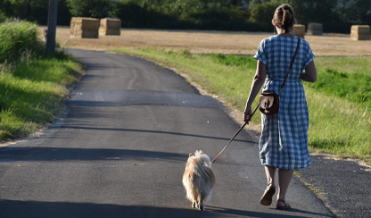 Woman walking a dog