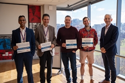 Jeremy William, Jonathan Shaw, Andrew Murphy and Graeme Lancaster receiving their Best of Baker certificates from John Greenwood on behalf of their teams